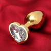 Фото товара: Золотистая анальная пробка с прозрачным кристаллом в форме сердца, код товара: 5215676/Арт.238632, номер 1