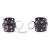 Купить Черные кожаные наручники с люверсами код товара: СН-1051/Арт.381199. Онлайн секс-шоп в СПб - EroticOasis 